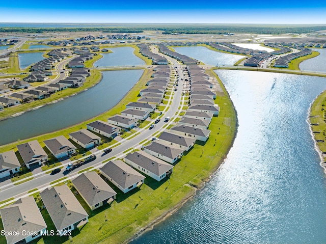 bird's eye view with a residential view and a water view