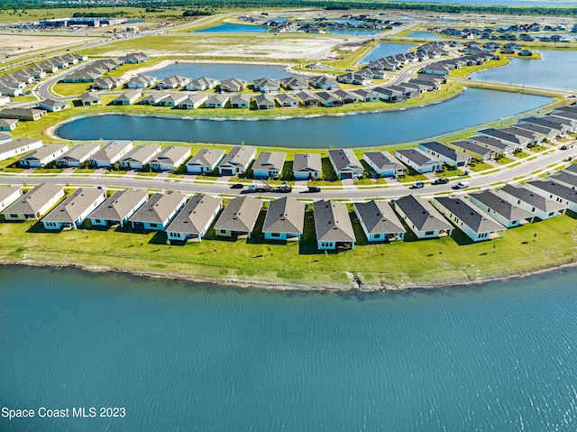 bird's eye view featuring a residential view and a water view