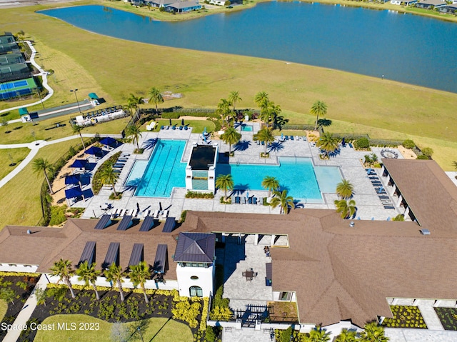 birds eye view of property with a water view