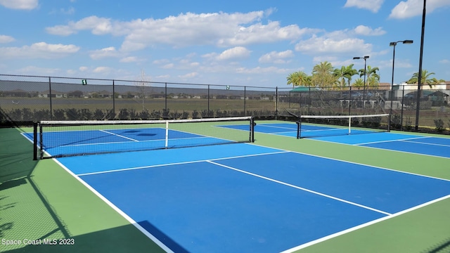 view of sport court featuring community basketball court and fence