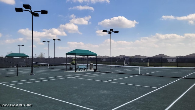 view of sport court with fence