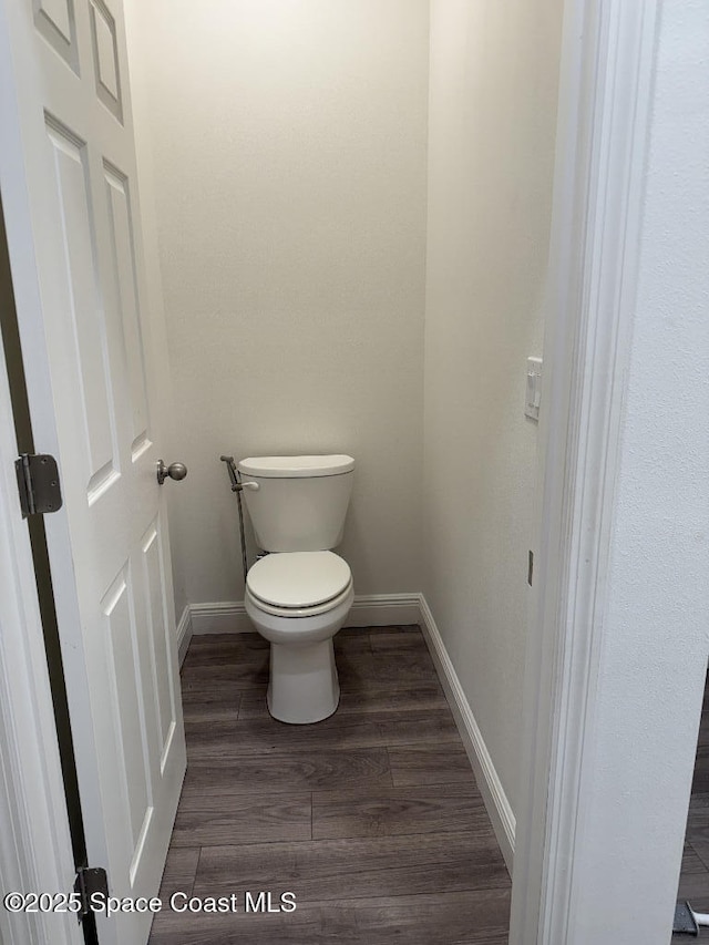 1430 Denali St SE, Palm Bay, FL 32909 - bathroom with baseboards, toilet, and wood finished floors
