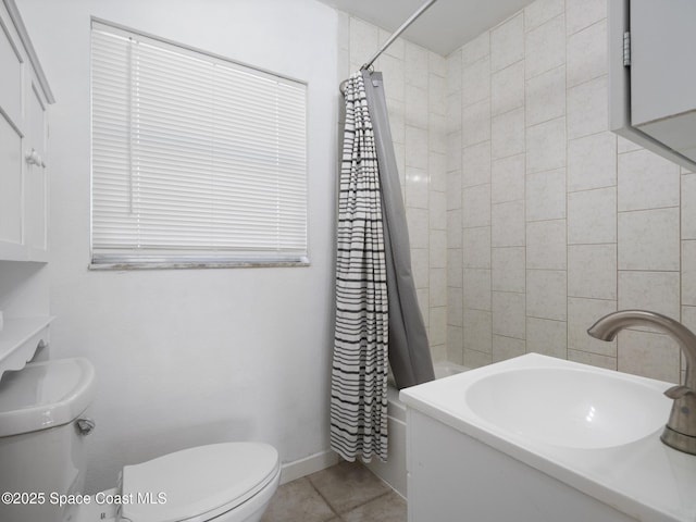 1640 Barna Ave, Titusville, FL 32780 - bathroom with a sink, shower / bath combination with curtain, baseboards, toilet, and tile patterned flooring
