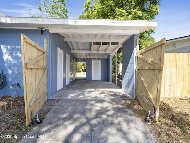 1640 Barna Ave, Titusville, FL 32780 - view of car parking featuring fence and a carport