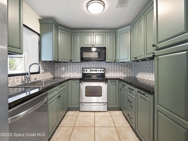 1640 Barna Ave, Titusville, FL 32780 - kitchen featuring visible vents, appliances with stainless steel finishes, and green cabinetry