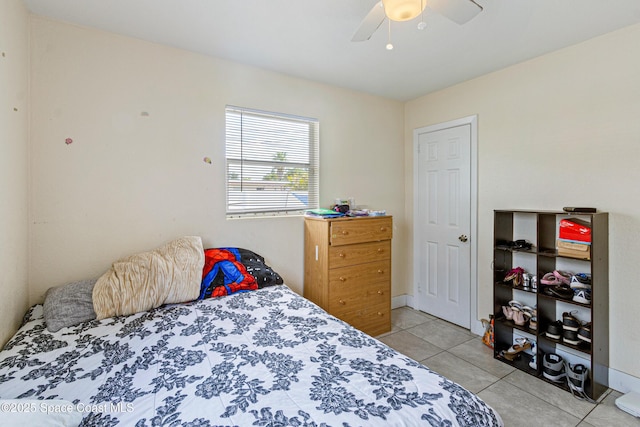 bedroom featuring a ceiling fan and light tile patterned floors