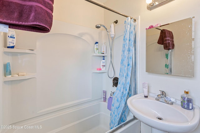 full bathroom with shower / tub combo and a sink