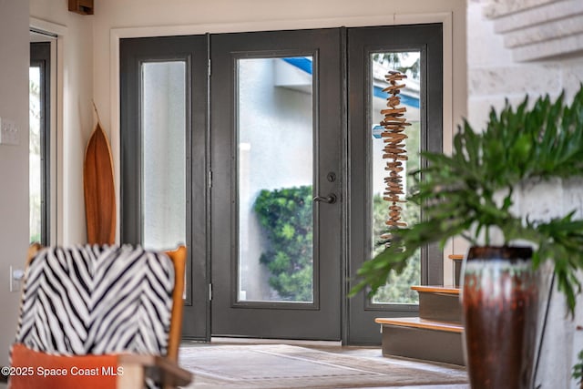 450 Ross Ave, Melbourne Beach, FL 32951 - doorway to outside featuring plenty of natural light