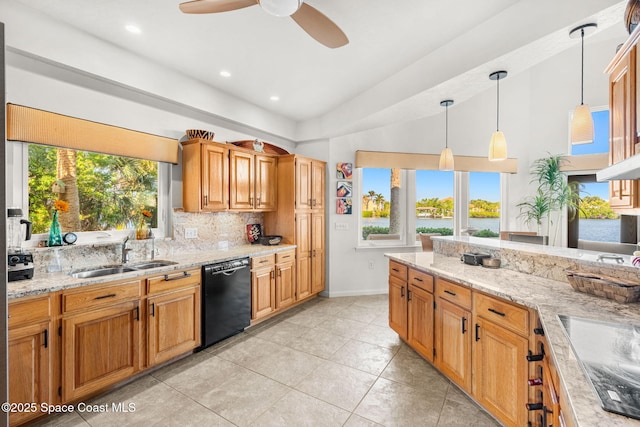 450 Ross Ave, Melbourne Beach, FL 32951 - kitchen featuring a ceiling fan, black appliances, light stone counters, a sink, and decorative backsplash