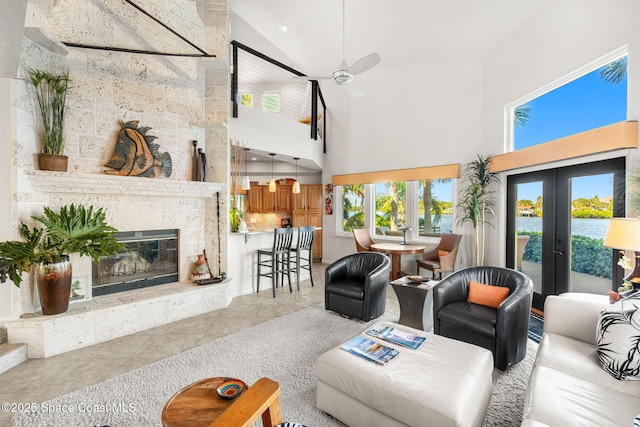450 Ross Ave, Melbourne Beach, FL 32951 - living area featuring french doors, tile patterned floors, high vaulted ceiling, and ceiling fan