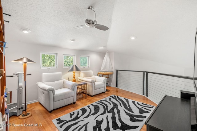 450 Ross Ave, Melbourne Beach, FL 32951 - sitting room featuring light wood-type flooring, a textured ceiling, and ceiling fan