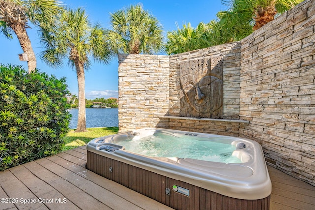 450 Ross Ave, Melbourne Beach, FL 32951 - wooden deck featuring a water view and hot tub deck surround