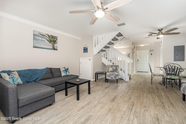 326 Seaport Blvd Unit T95, Cape Canaveral, FL 32920 - living area with electric panel, stairway, a ceiling fan, light wood-style flooring, and crown molding