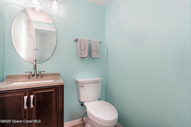 326 Seaport Blvd Unit T95, Cape Canaveral, FL 32920 - bathroom featuring vanity, toilet, and baseboards