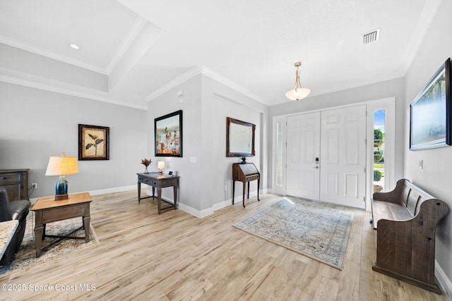 foyer featuring baseboards, visible vents, recessed lighting, wood finished floors, and crown molding