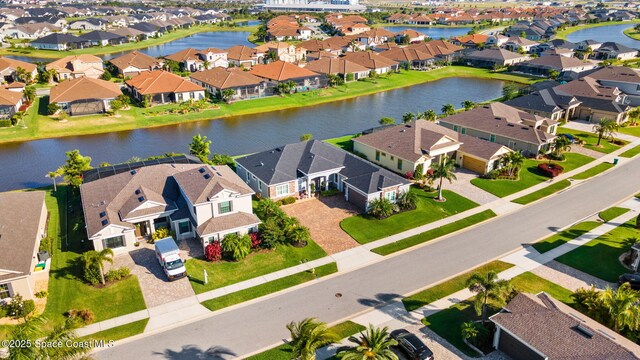 aerial view with a water view and a residential view
