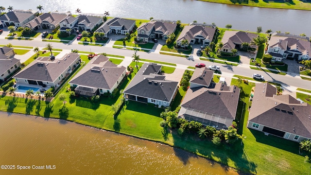 bird's eye view with a residential view and a water view
