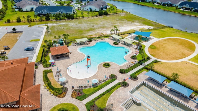 bird's eye view featuring a residential view and a water view