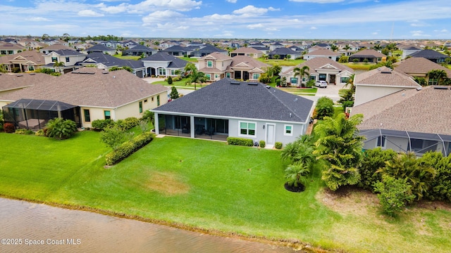 birds eye view of property with a residential view