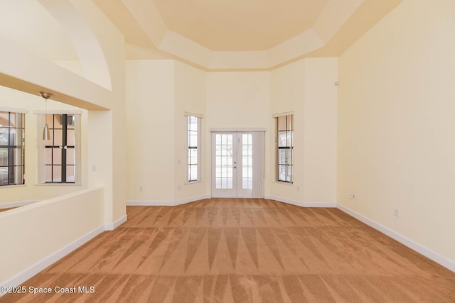 4068 Gardenwood Cir, Grant, FL 32949 - carpeted spare room with baseboards and a towering ceiling