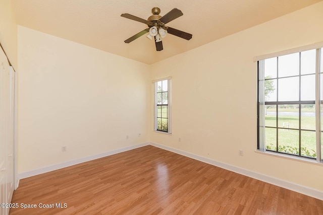 4068 Gardenwood Cir, Grant, FL 32949 - unfurnished room featuring light wood-style floors, baseboards, and ceiling fan