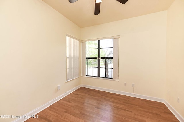4068 Gardenwood Cir, Grant, FL 32949 - unfurnished room with ceiling fan, wood finished floors, and baseboards