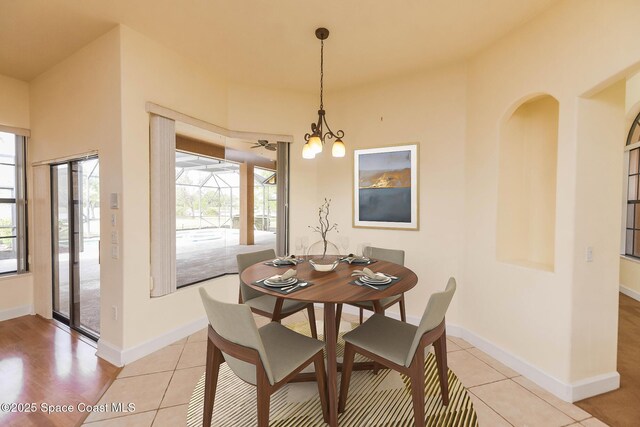 4068 Gardenwood Cir, Grant, FL 32949 - dining area featuring plenty of natural light, light tile patterned flooring, and baseboards