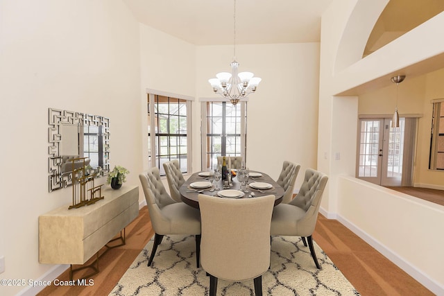 4068 Gardenwood Cir, Grant, FL 32949 - dining area with a chandelier, plenty of natural light, baseboards, and a high ceiling