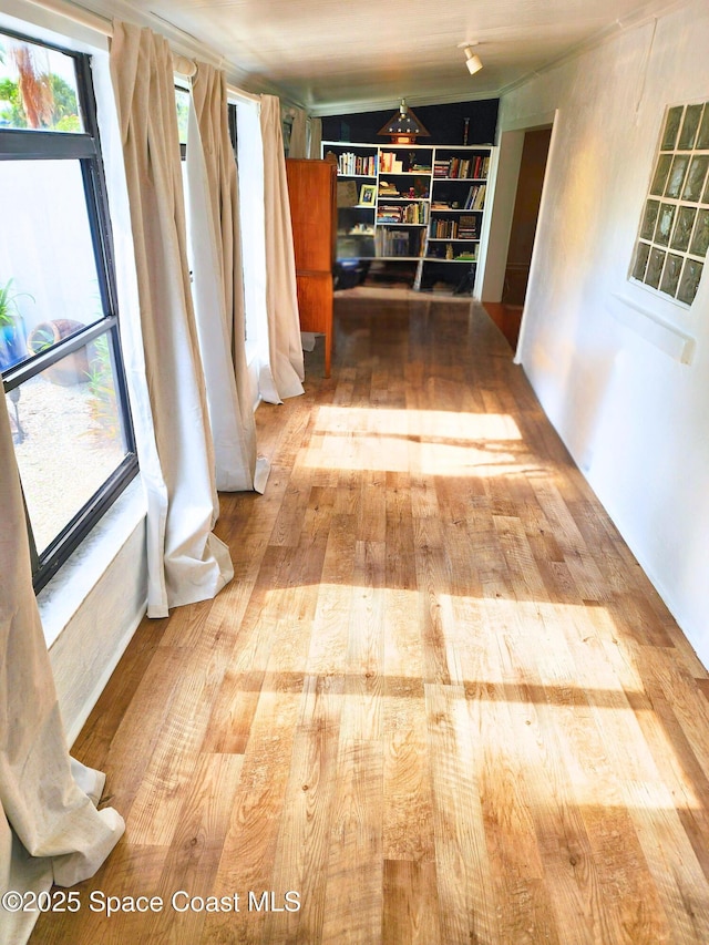 corridor with wood finished floors