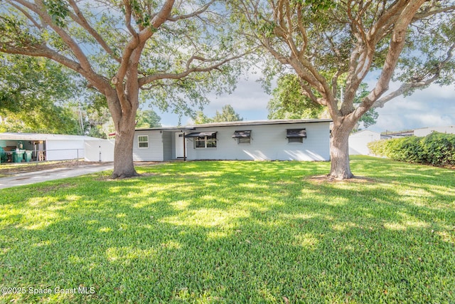 2910 Tropic Rd, Melbourne, FL 32935 - view of front of property featuring a front lawn