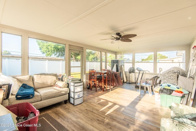 2910 Tropic Rd, Melbourne, FL 32935 - sunroom / solarium with wood finished floors, a wooden deck, a ceiling fan, and outdoor dining space