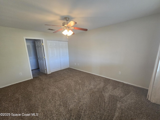unfurnished bedroom with visible vents, baseboards, a closet, a ceiling fan, and carpet