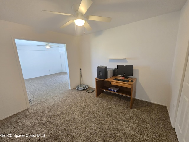 office area featuring a ceiling fan and carpet floors
