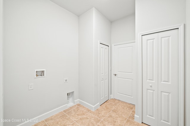4280 Alamanda Key Dr, Melbourne, FL 32901 - laundry room featuring light tile patterned floors, baseboards, washer hookup, laundry area, and electric dryer hookup