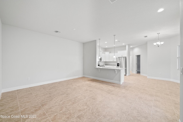4280 Alamanda Key Dr, Melbourne, FL 32901 - unfurnished living room featuring baseboards, an inviting chandelier, recessed lighting, light tile patterned floors, and visible vents