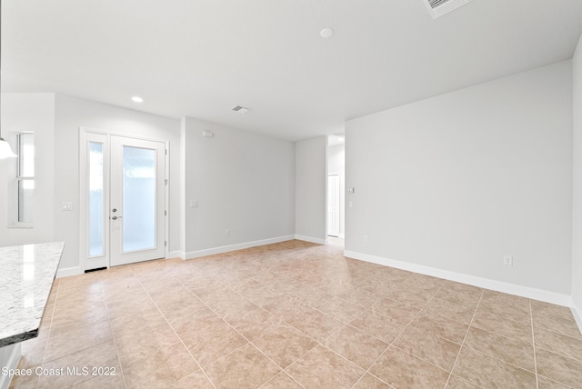 4280 Alamanda Key Dr, Melbourne, FL 32901 - unfurnished living room featuring visible vents, baseboards, and recessed lighting