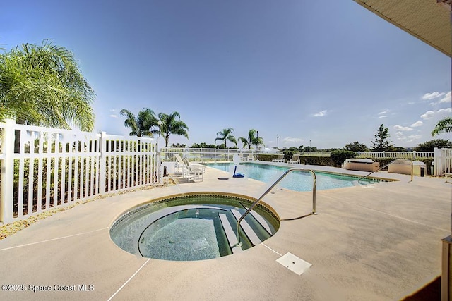 4280 Alamanda Key Dr, Melbourne, FL 32901 - community pool featuring a patio area, fence, and a community hot tub