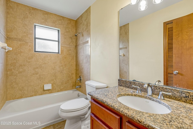 bathroom with vanity, bathtub / shower combination, and toilet