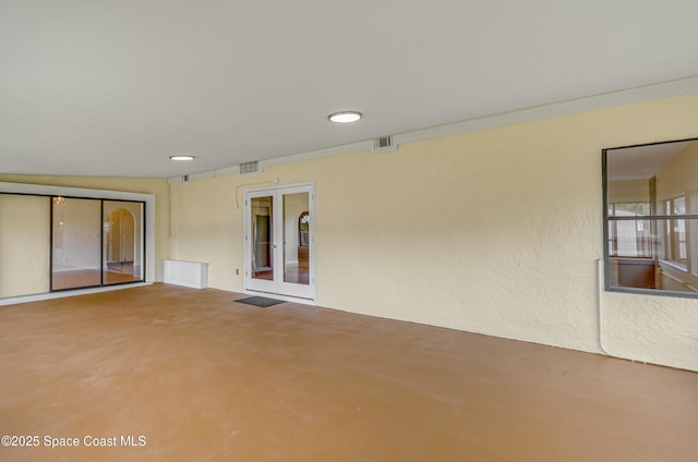 view of patio featuring french doors and visible vents