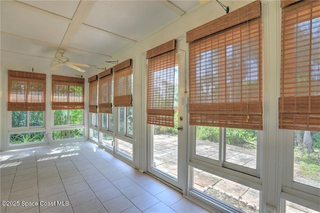 unfurnished sunroom featuring tile patterned floors