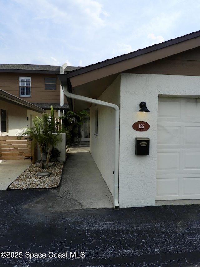view of side of property featuring stucco siding