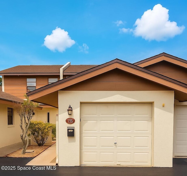 155 Kristi Dr, Indian Harbour Beach, FL 32937 - view of front of home with stucco siding