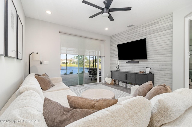 living room with recessed lighting, ceiling fan, and visible vents