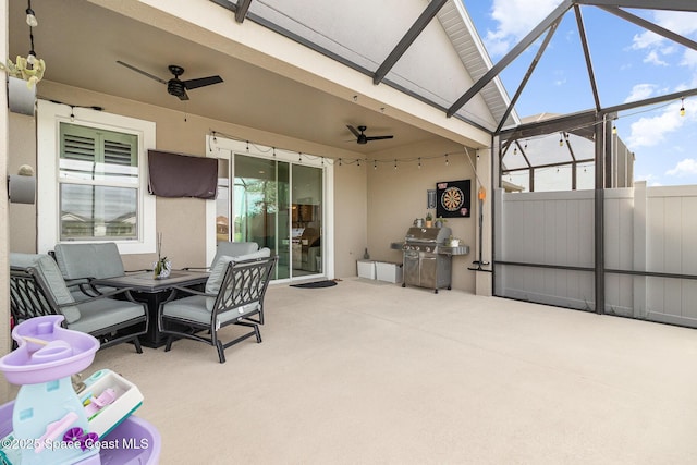 view of patio featuring outdoor dining space, ceiling fan, glass enclosure, and a grill