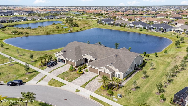 bird's eye view with a residential view and a water view