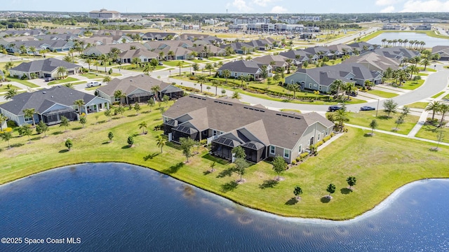 birds eye view of property featuring a residential view and a water view