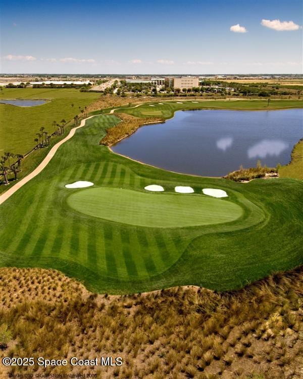 view of community with a water view and golf course view