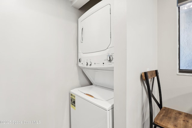 washroom with laundry area and stacked washer and dryer