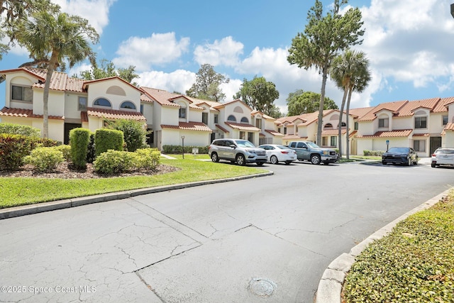 view of street with curbs and a residential view