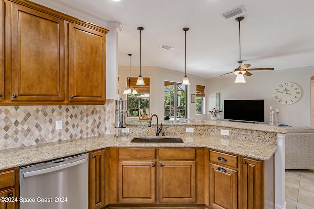 kitchen featuring a peninsula, open floor plan, visible vents, stainless steel dishwasher, and a sink